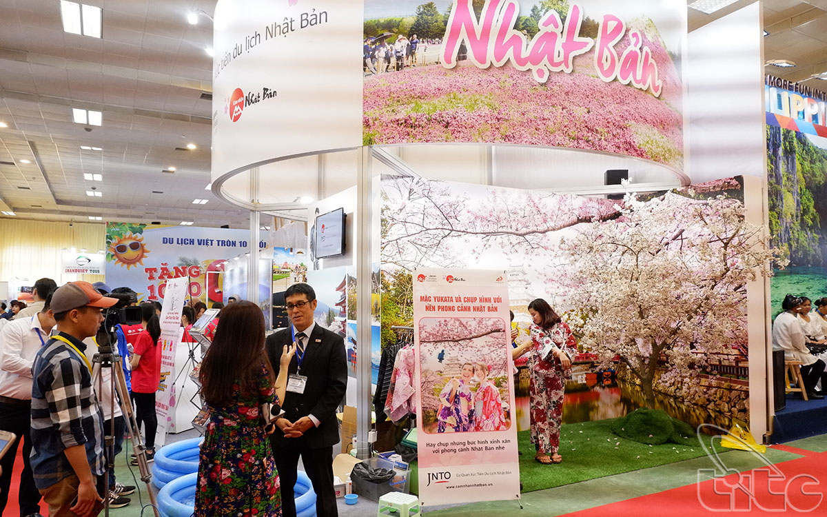 Booth of Japan tourism stands out by the images of cherry blossoms